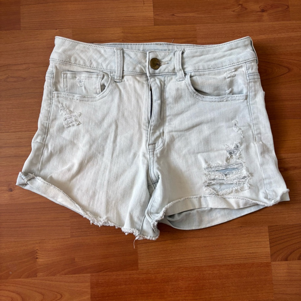 Womens Distressed light wash American eagle denim shirts size 6